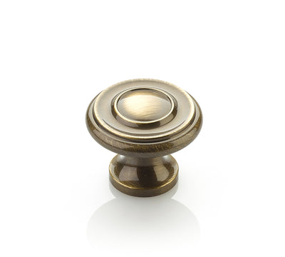 Schaub Traditional Knobs 1-1/4" Stepped Round Knob in Antique Brass